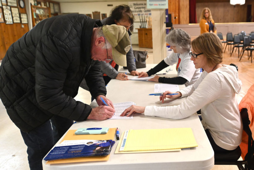 Click to enlarge Caucus goers in Iowa