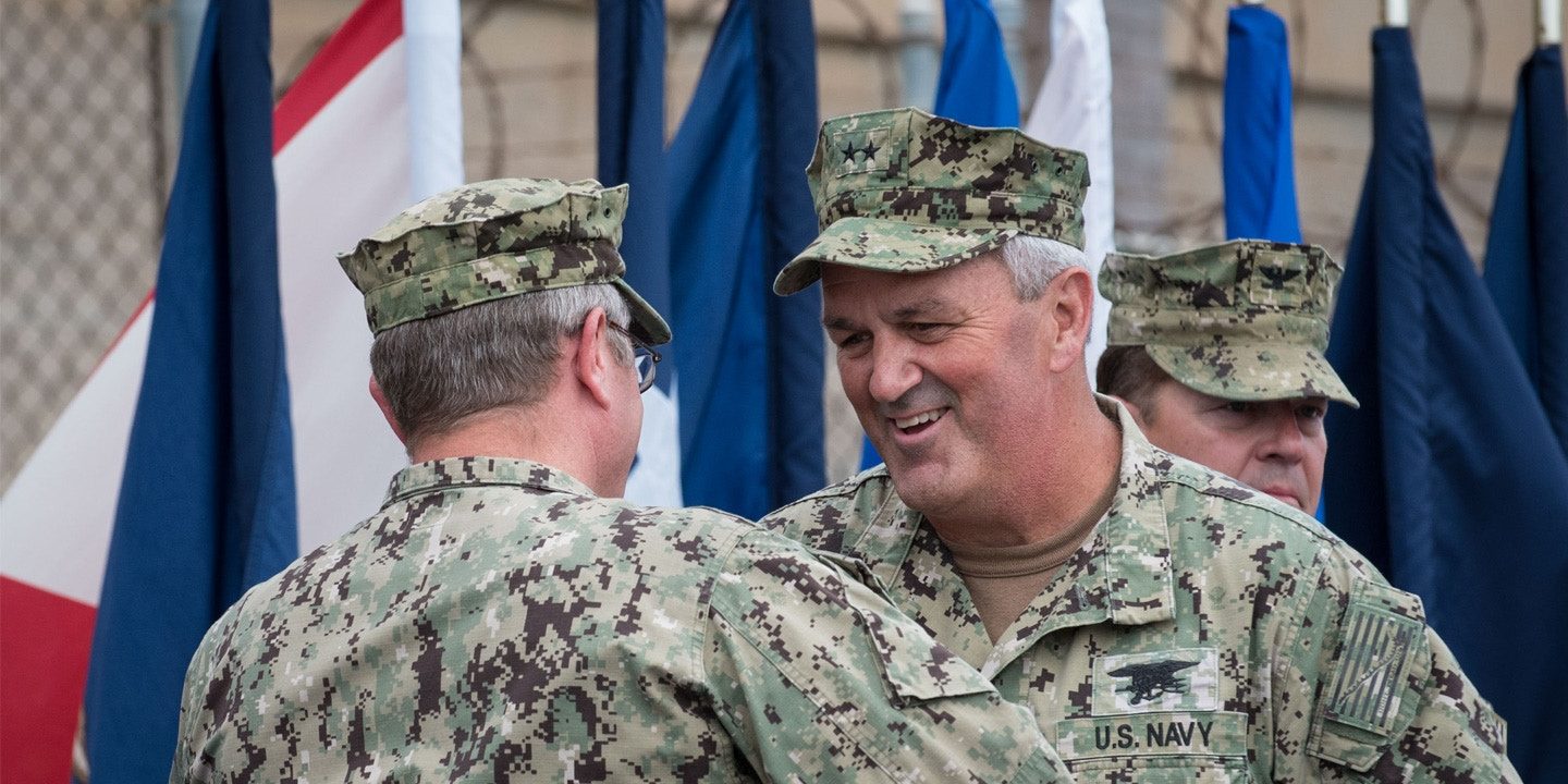 Click to enlarge Rear Adm. Collin Green, Rear Adm. Tim Szymanski