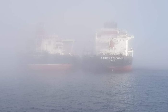 Container ships at Fremantle Port were shrouded in the heavy fog