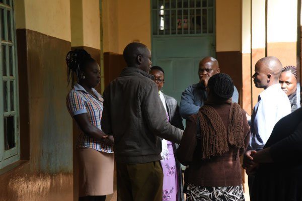 Kakamega Primary School head teacher Dickson Wanyangu (second left) and staff at the institution on February 6, 2020.