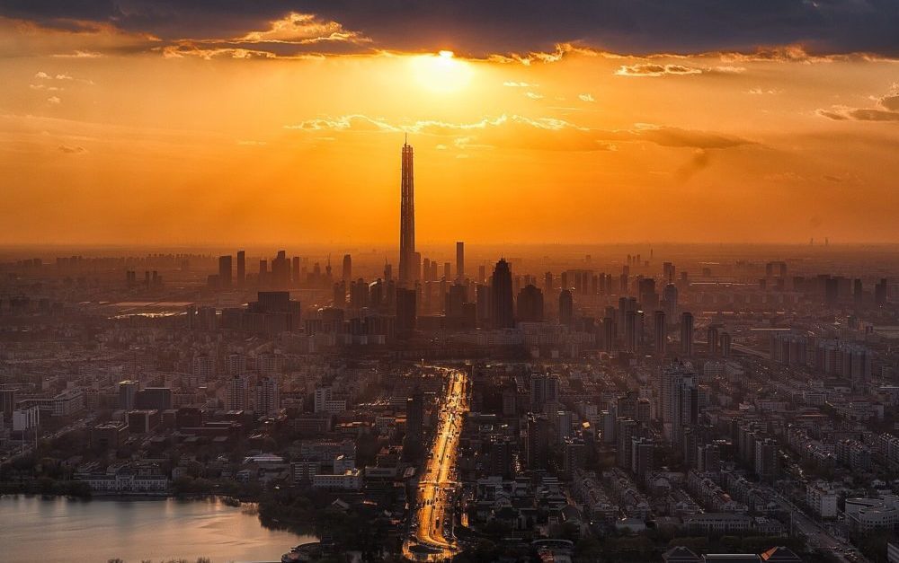 Click to enlarge city sun clouds