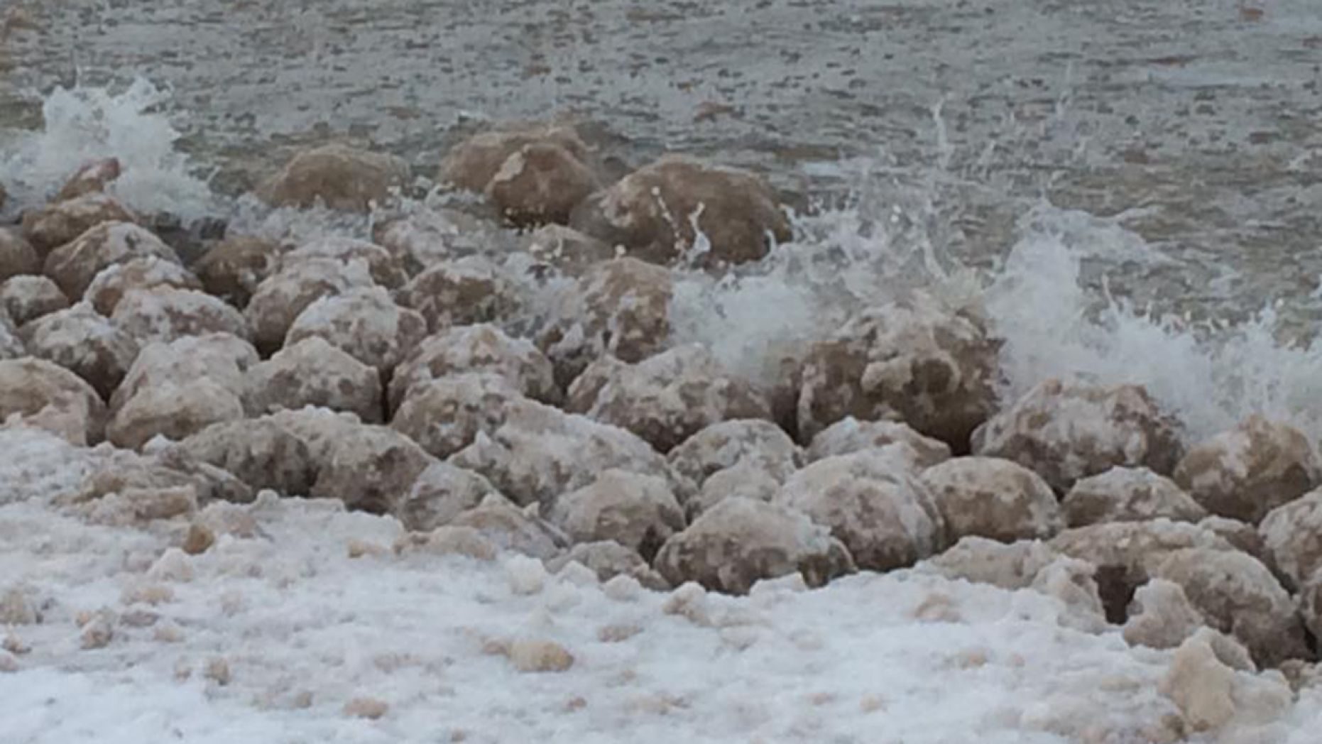 Click to enlarge The ice balls spotted Friday along Lake Michigan varied in size.