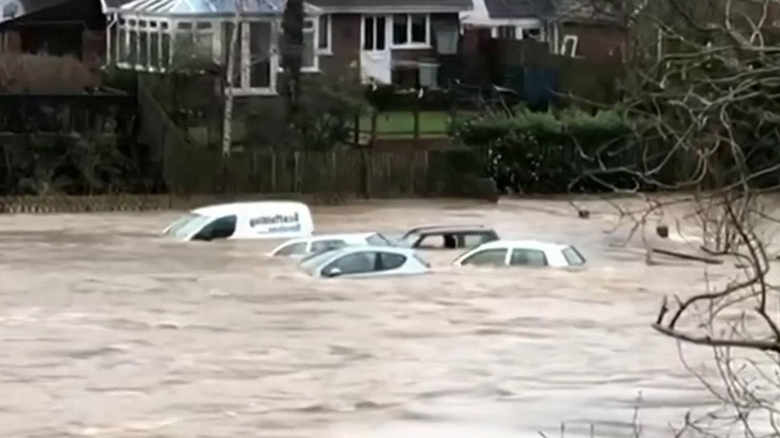 Click to enlarge Submerged cars are swept away by flooding in the town of Hay-on-Wye as Storm Dennis brought heavy rain and winds to the UK