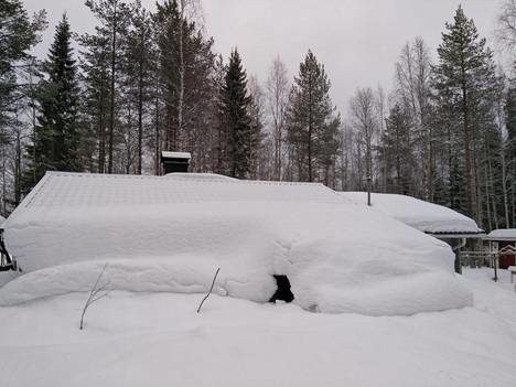 Click to enlarge The cabin is hidden behind the snow. Suomussalmi has a lot of snow.