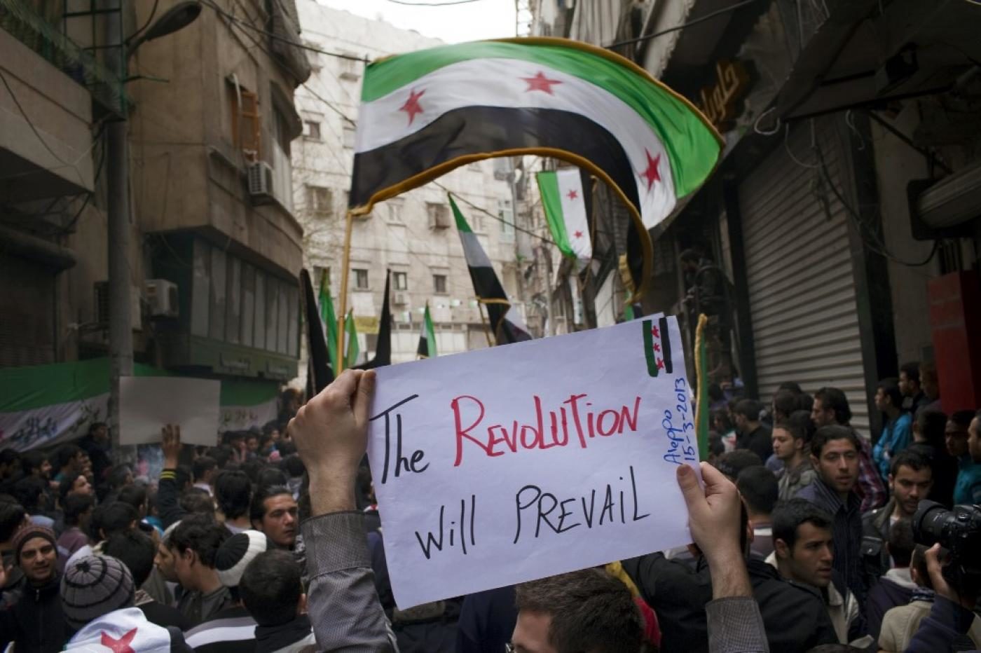 Click to enlarge Anti-government protesters in Aleppo