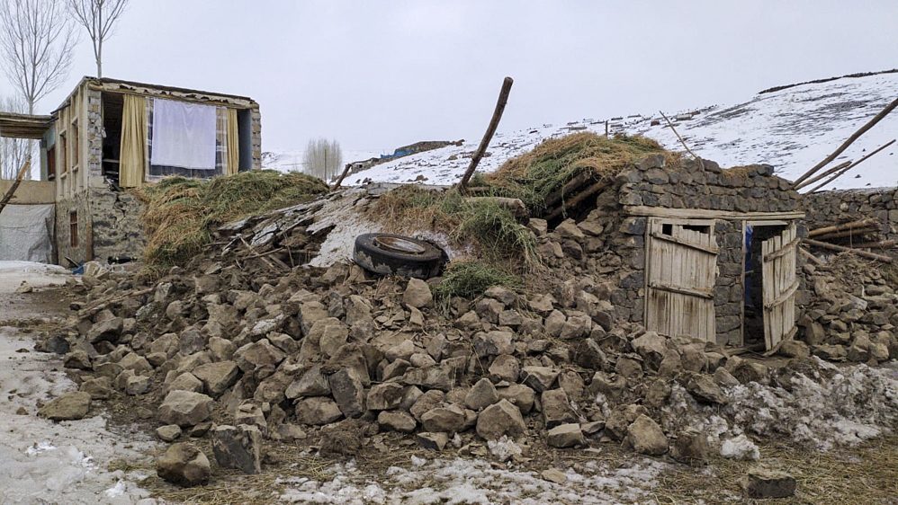 Wreckage of a mud-brick construction is seen after tremors from a 5.7-magnitude quake centered in northwestern Iran were also felt in Turkey's Van province