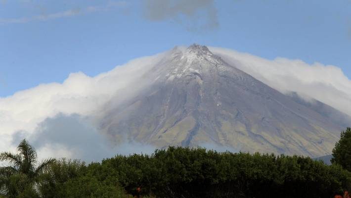 Click to enlarge Mount Taranaki was cloaked in cloud and wearing a fresh dusting of snow on Sunday morning.