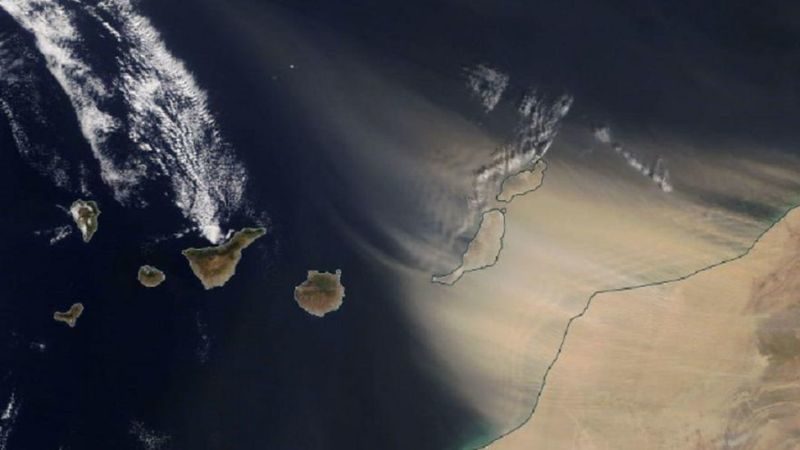 Click to enlarge A satellite image shows the sandstorm blasting the Canary Islands from the east