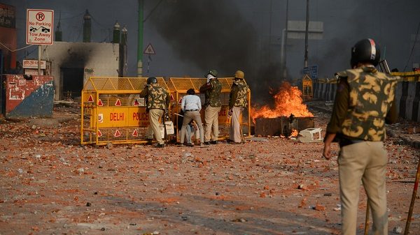 Policemen clash with protesters