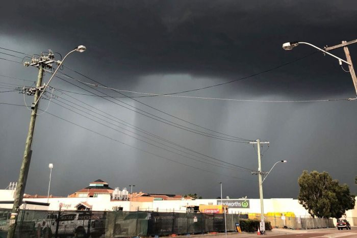 Click to enlarge Dark clouds loomed over Morley as the storm front moved across Perth's northern suburbs