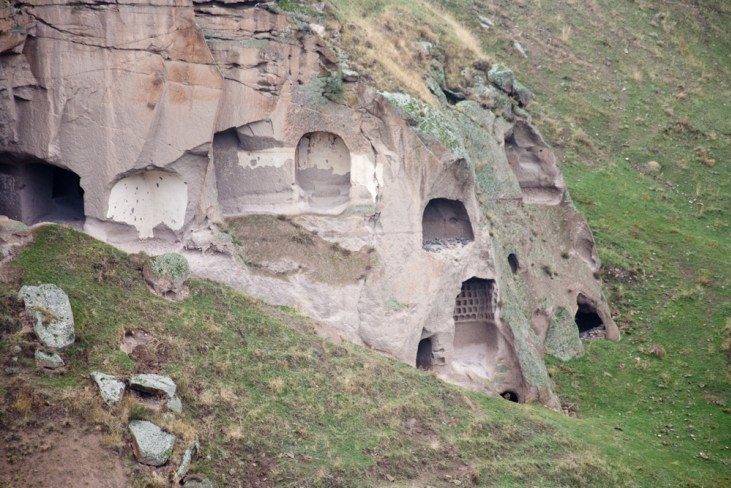 Click to enlarge rock-carved village in Ani