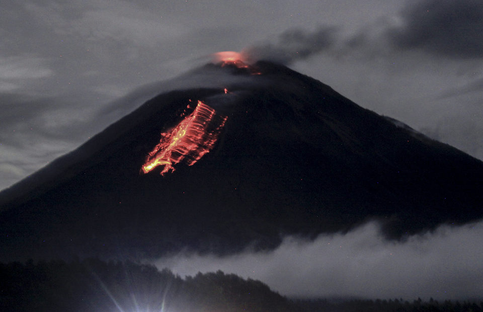 Lava flowing out of Mount Semeru's crater seen from Pranajiwo village near Lumajang in East Java on Wednesday.