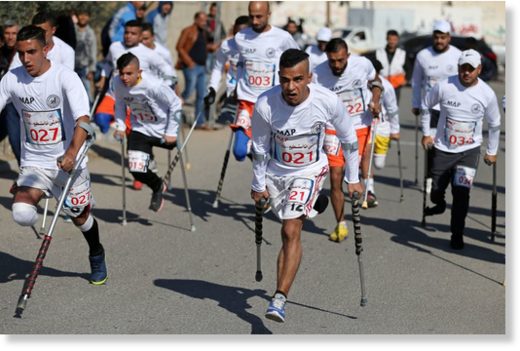 Click to enlarge Palestinian amputees compete in a local run