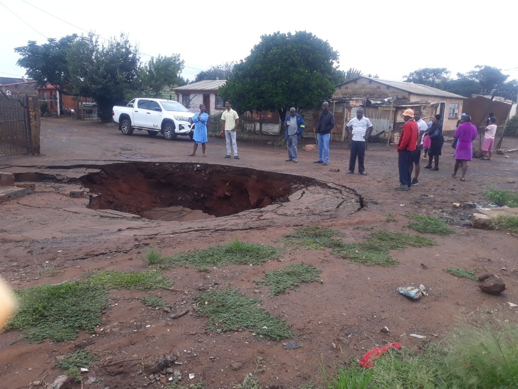 Click to enlarge Flooding in Khutsong has exacerbated sinkholes in the area.