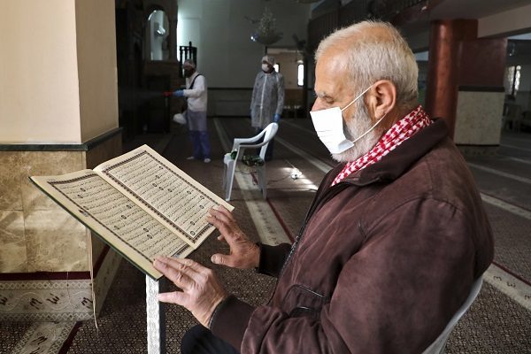 Man reading from Koran