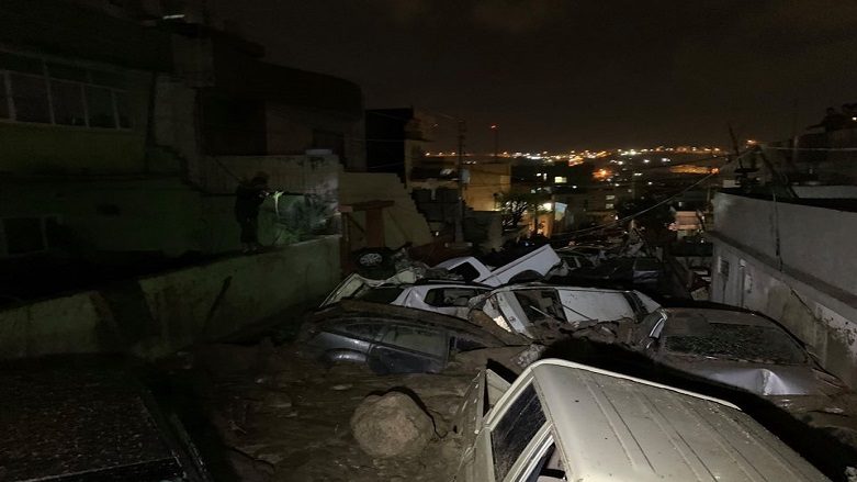 The aftermatch after a pile of cars were swept away by flash floods in Duhok city, March 18, 2020.