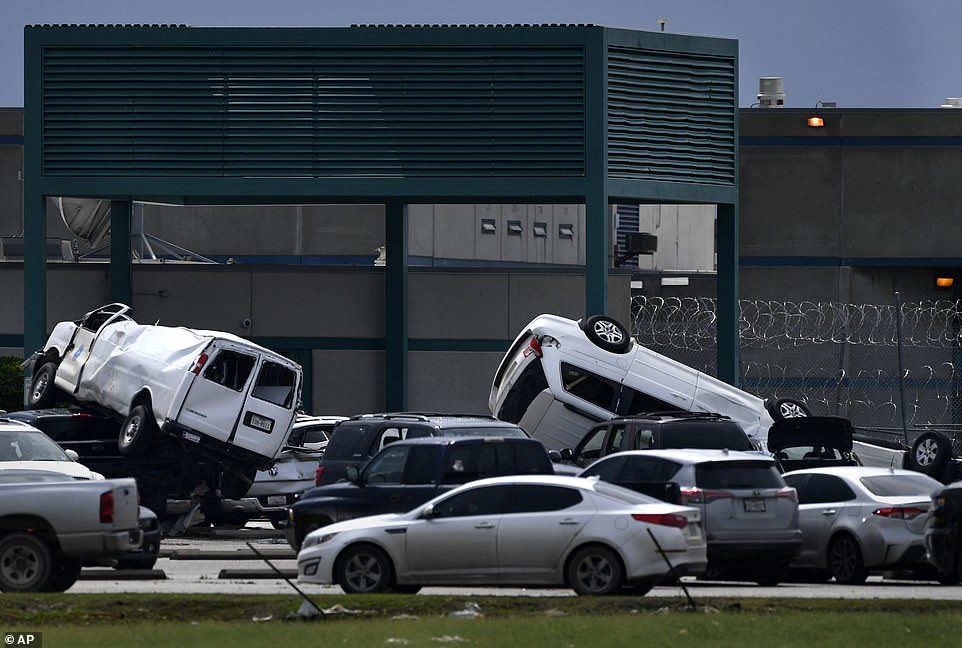 Click to enlarge A tornado flipped cars when it roared through Abilene, Texas
