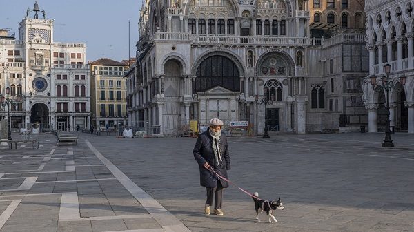 Click to enlarge An elderly person walks his dog