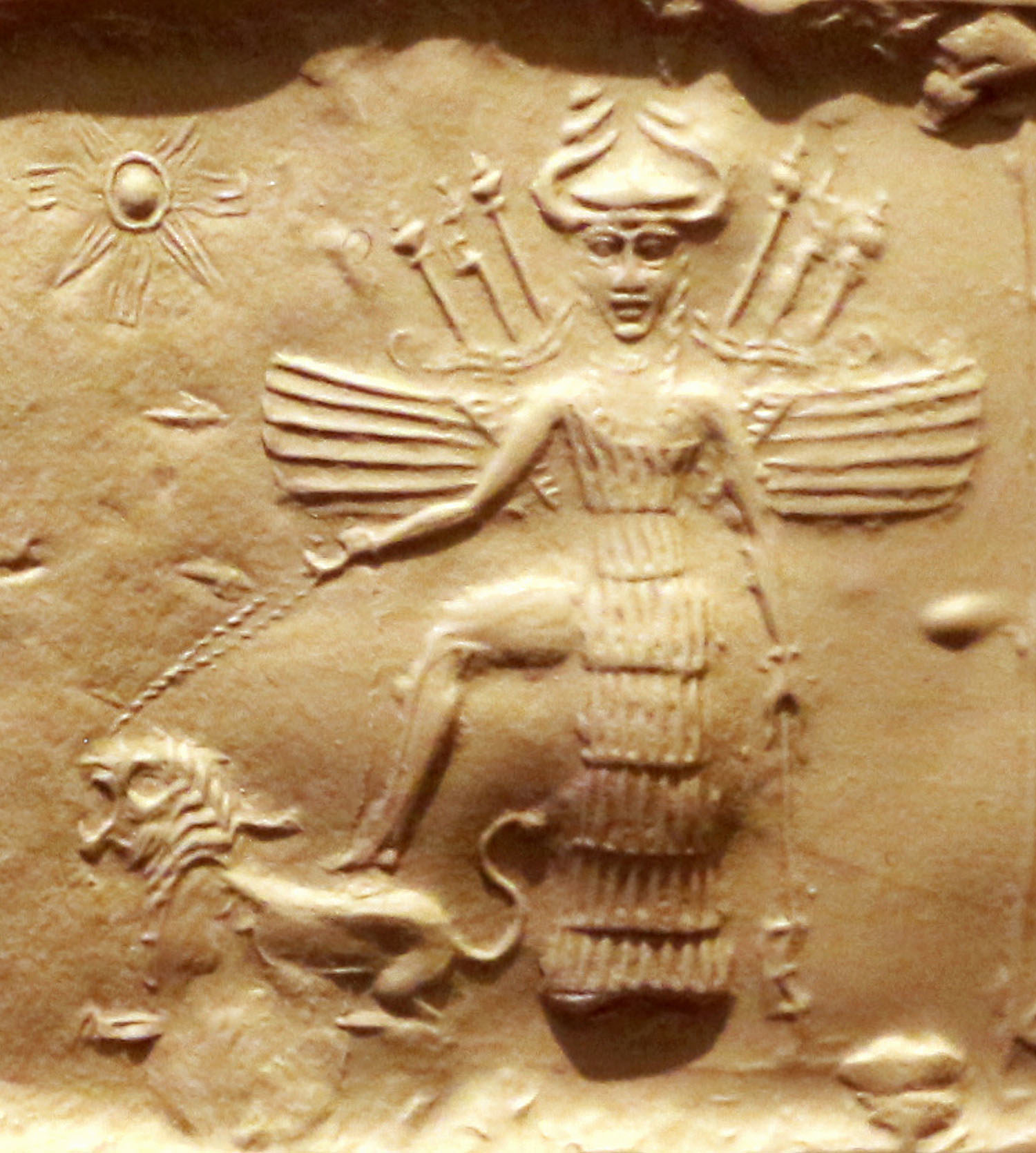 Click to enlarge Innana on an Akkadian seal. She is equipped with 7 spears, a horned helmet and a 7 segments dress