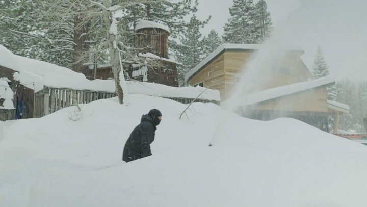 Click to enlarge Heavy snow buries empty ski resort