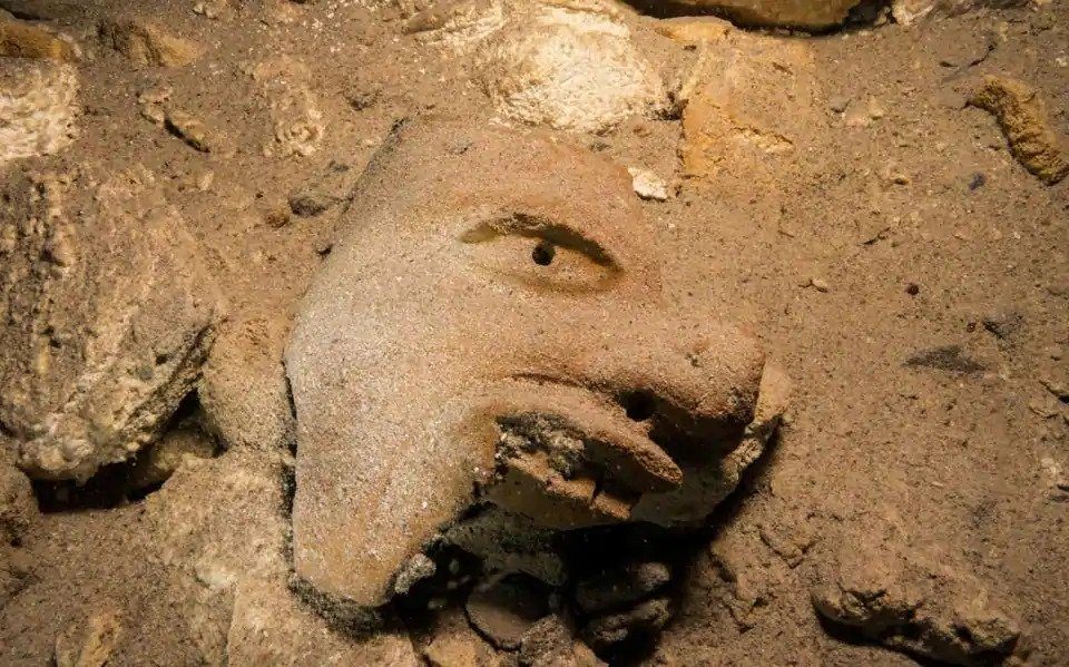 underwater cave mexico mayan mask