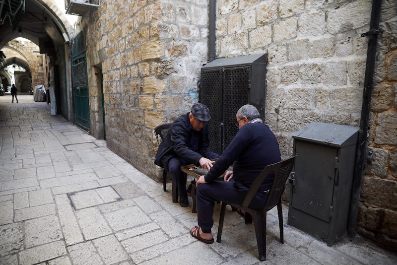 Palestinians play a board game