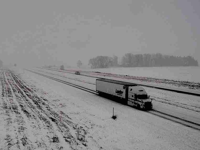 Traffic moves along snow-covered Interstate 90