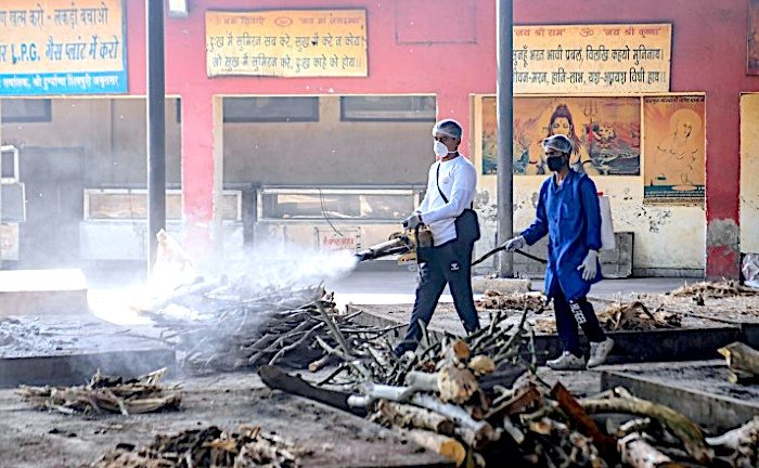 Click to enlarge 2 guys spraying wood