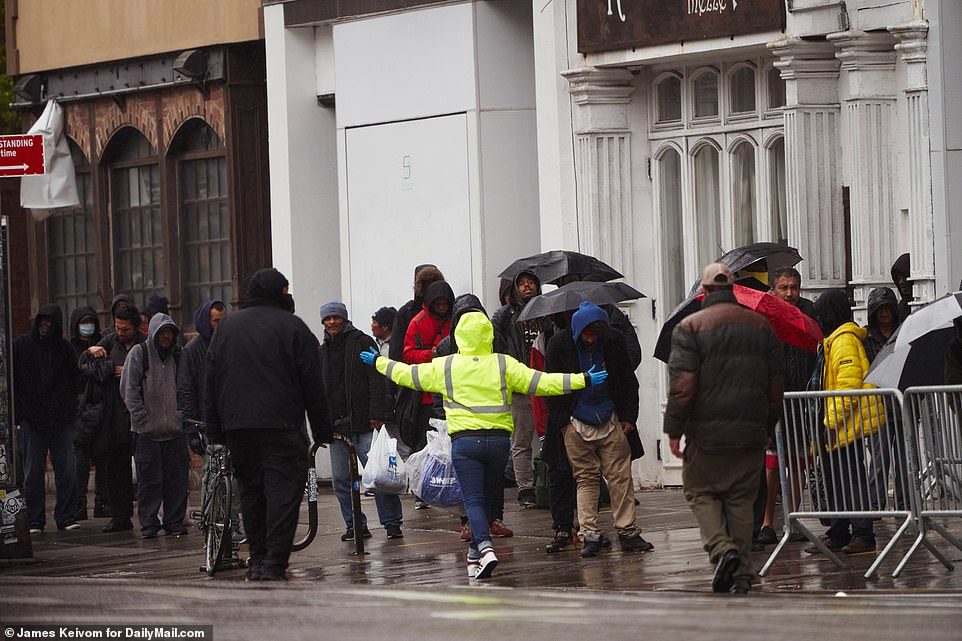 Click to enlarge People in line at soup kitchen