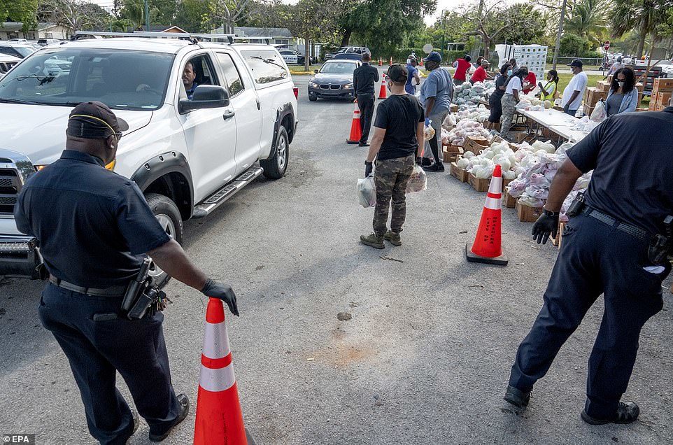 Click to enlarge Cars line up for food