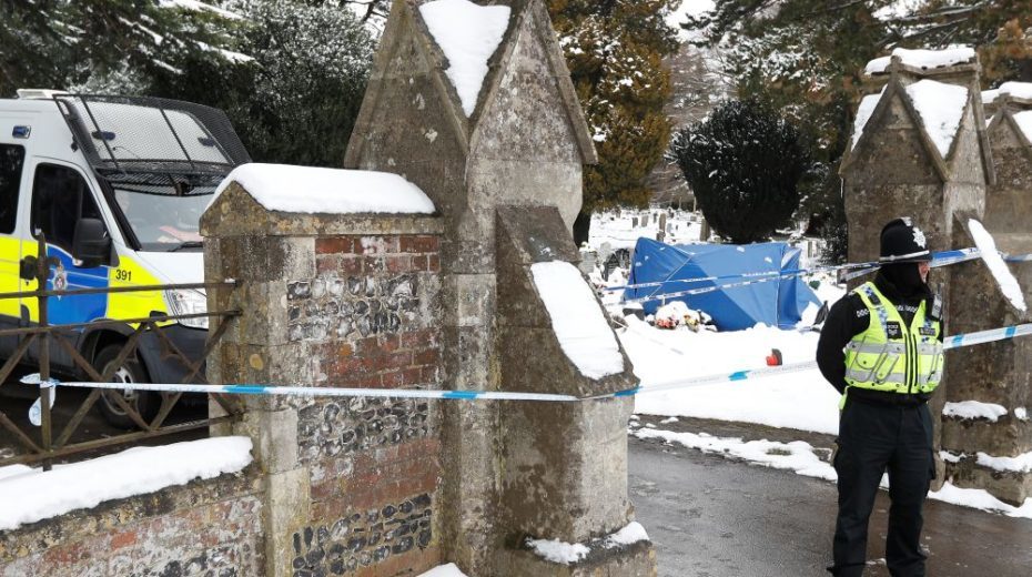 Click to enlarge police guard skripal cemetary skripal son