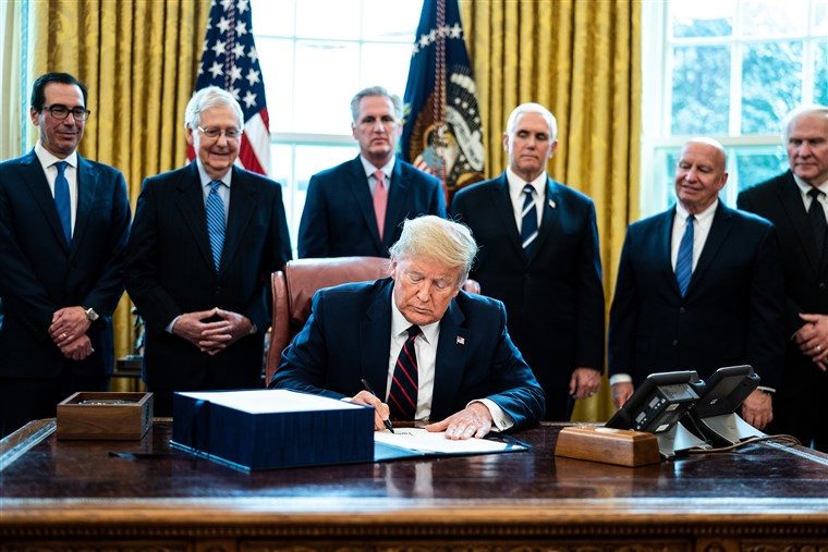 Click to enlarge Trump signs economic bill coronavirus