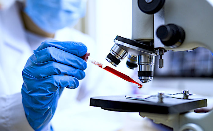 Click to enlarge lab worker