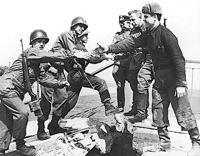 Click to enlarge Troops handshakes