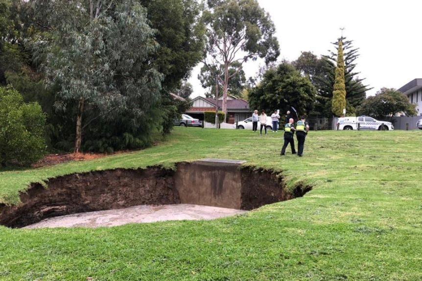 People at the scene were advised to keep 20 metres away from the hole as it continues to grow.