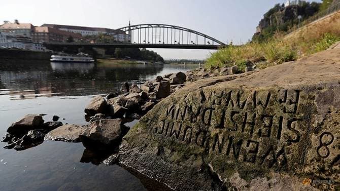 One of the 'hunger stones' revealed by the low level of water in the Elbe River is seen in Decin, Czech Republic, August 29, 2018.
