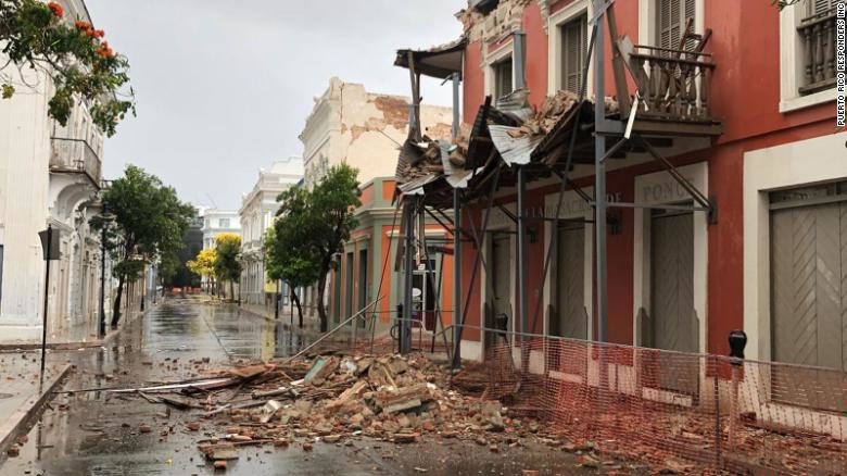 Rubble litters a street in Puerto Rico after Saturday's temblor.