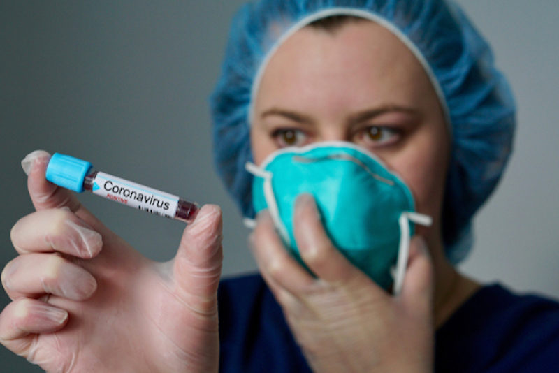 nurse covid-19 vial
