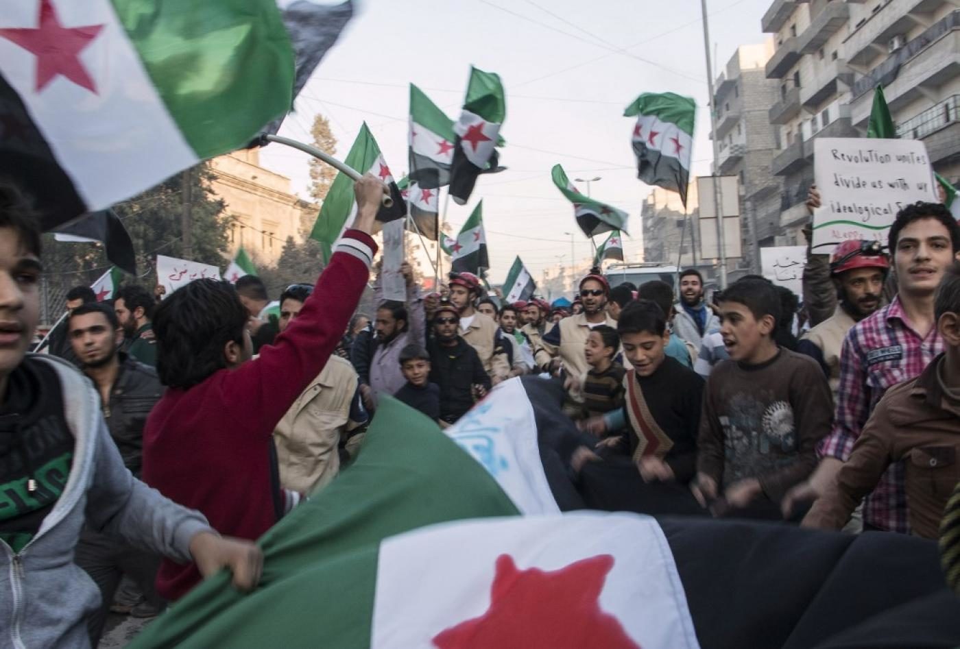 Syrians rally in support of the Free Syrian Army in eastern Aleppo in November 2014