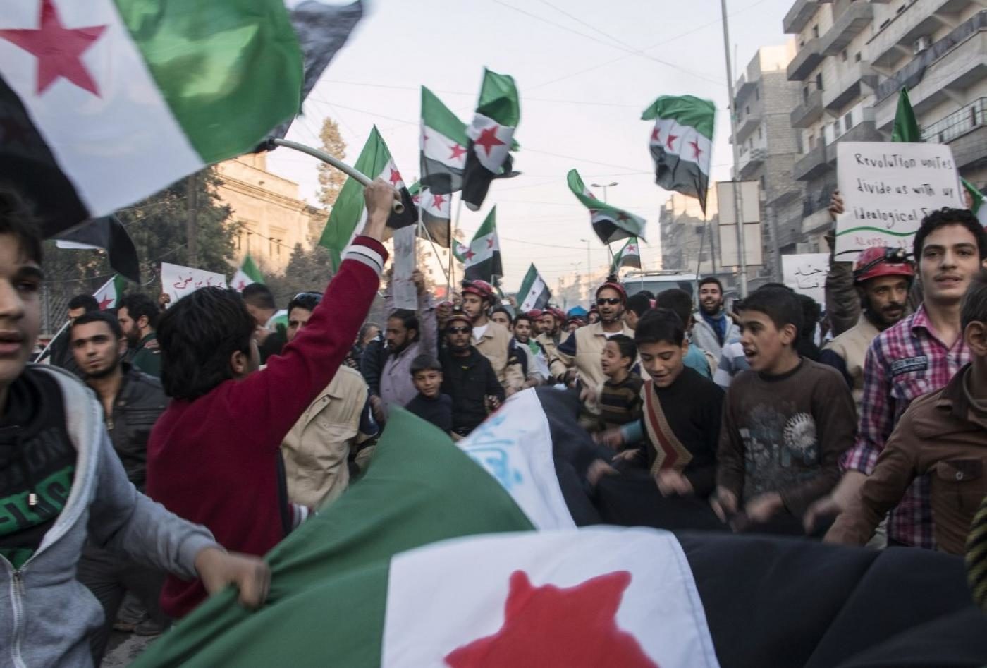 Click to enlarge Syrians rally in support of the Free Syrian Army in eastern Aleppo in November 2014