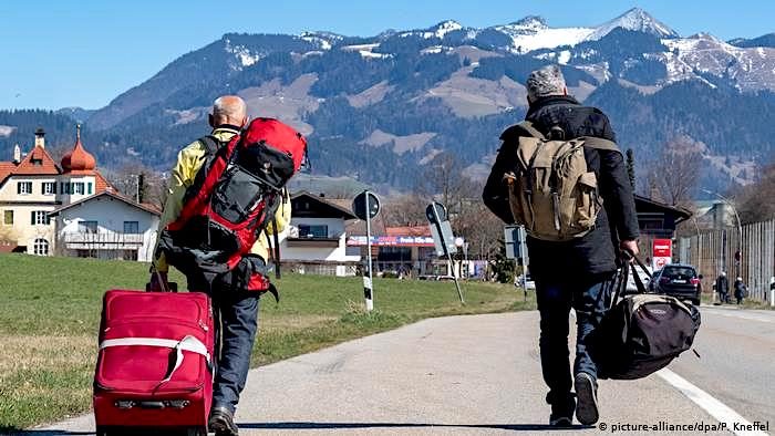 2 hikers on road