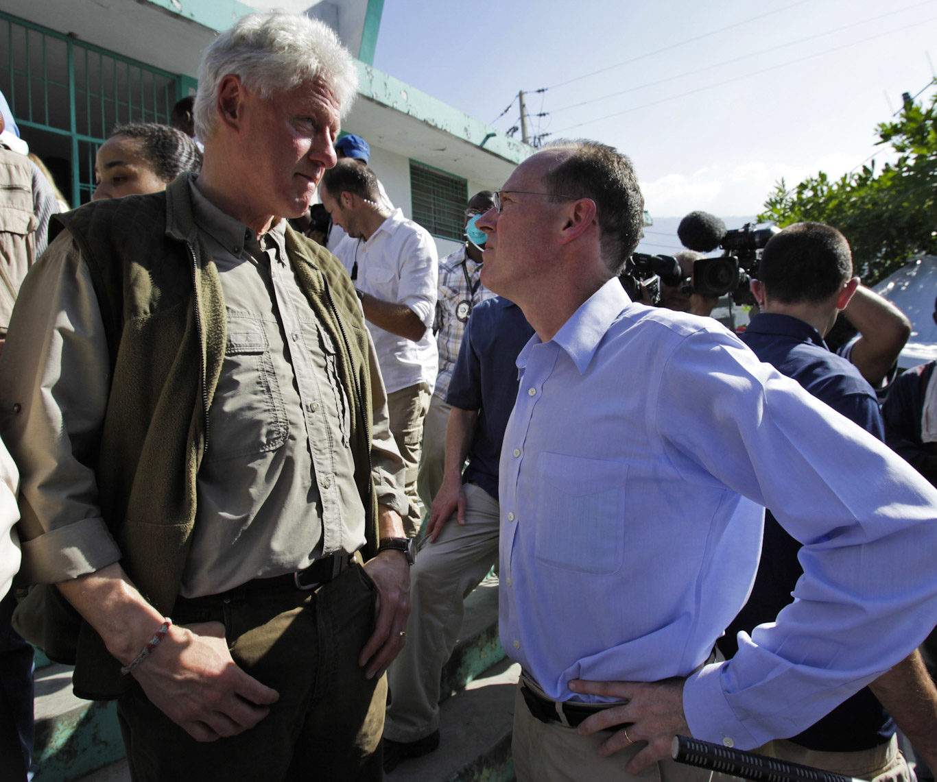 Bill Clinton, left, talks to Dr. Paul Farmer while touring the General Hospital in Port-au-Prince, Jan. 18, 2010.