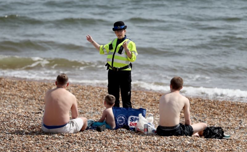 Police Officer patrols Brighton beach