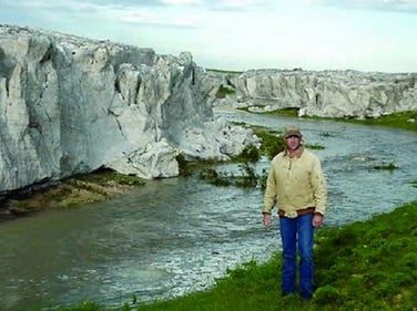 Click to enlarge Hail cliffs 15 feet high line the bottom of a creek