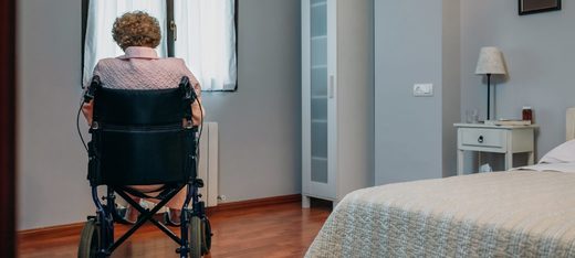 elderly woman in wheelchair, care home