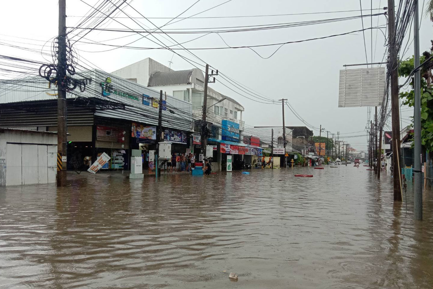 The Khraeng intersection on Sakdidet Road is flooded after two hours of heavy rain in Muang district of Phuket on Saturday morning.