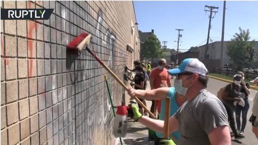 Beseiged Minneapolis residents unite to clean up streets after a night of destruction