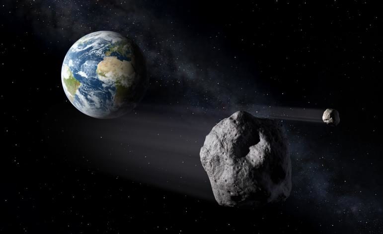 artistic illustration of an asteroid flying by Earth