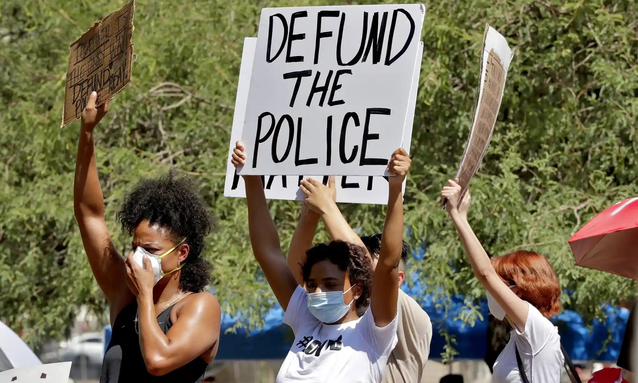 Click to enlarge defund the police protester