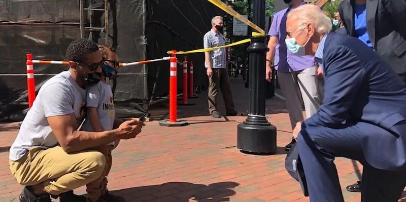 Click to enlarge Biden kneels